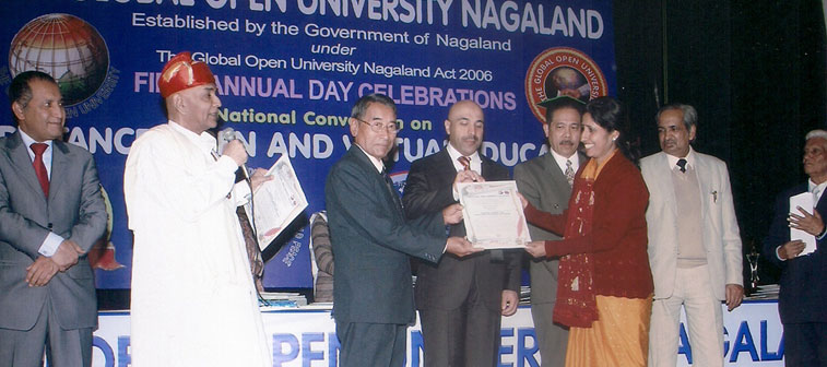 School Principal Receiving Award from University of Nagaland