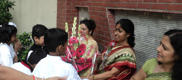 Children greeting the teachers on Independence Day Celebrations